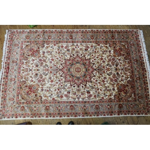 617 - An Oriental Silk Rug in Cream & Red. Measuring: 246cms x 158cms.