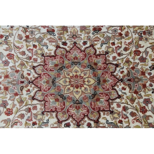 617 - An Oriental Silk Rug in Cream & Red. Measuring: 246cms x 158cms.