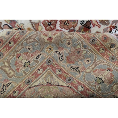 617 - An Oriental Silk Rug in Cream & Red. Measuring: 246cms x 158cms.