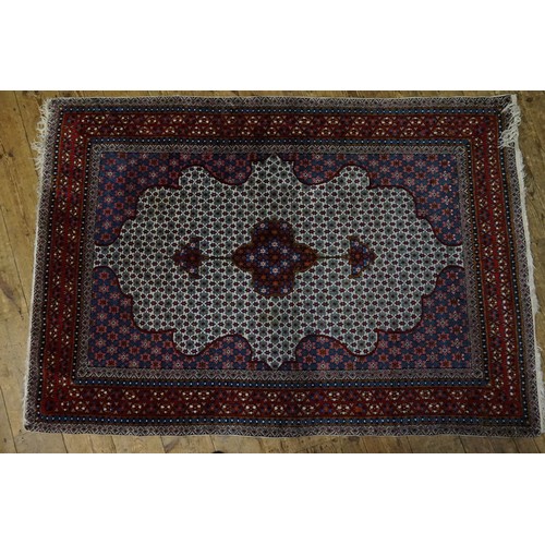 619 - A Dark Red & Cream Rug with Frill (AF). Measuring: 184cms x 125cms.