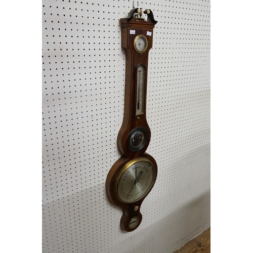 914 - A Georgian design banjo barometer, with nickel silvered faces, makers mark E. Ronchetti. of Exeter.