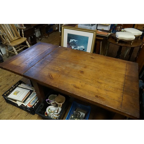 565 - A Country Made Oak Drawer Leaf Refractory Dining Table resting on square legs. Measuring: 91cms x 13... 