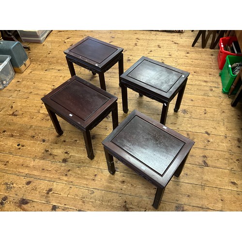 545 - A Set of Four Japanese Hardwood Whatnot Tables with inset Top Panels, Key Boarded Tops & Scroll Feet... 