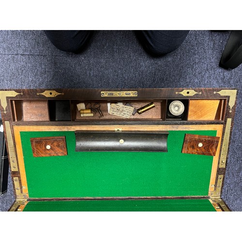 713 - An Early Victorian Campaign Writing Slope fitted with Brass edges, Brass inlay, quartered Corners, R... 