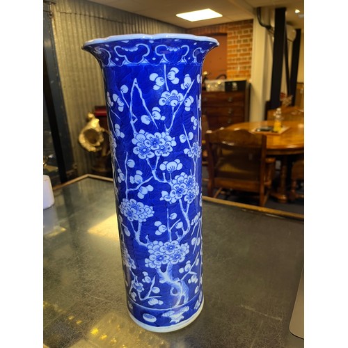 635 - A pair of Chinese blue and white trumpet shaped vases, decorated with prunus leaf. Measuring 36cm.