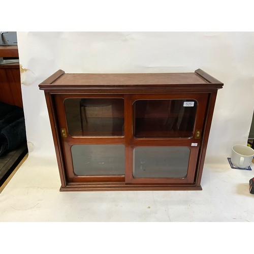 525 - A Mahogany Double Sliding Doored Glass Cabinet. Measuring: 61cms across x 47cms high x 25cms deep.