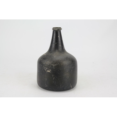 770 - An Antique Mallet shaped Green Glass Wine bottle with kicked in base and ribbed neck. Measuring: 18c... 