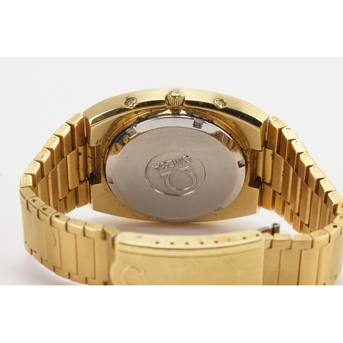 210 - A gentleman's Omega megaquartz 32 KHZ wrist watch, Geneve day date, champagne dial.