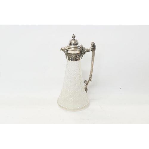 67 - A Claret Jug in the Classical design with a Silver Plated mount.