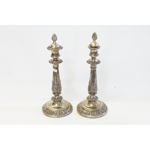 69 - A Pair of Silver on Copper Regency designed Candlesticks with gadrooned bases, one sconce missing al... 