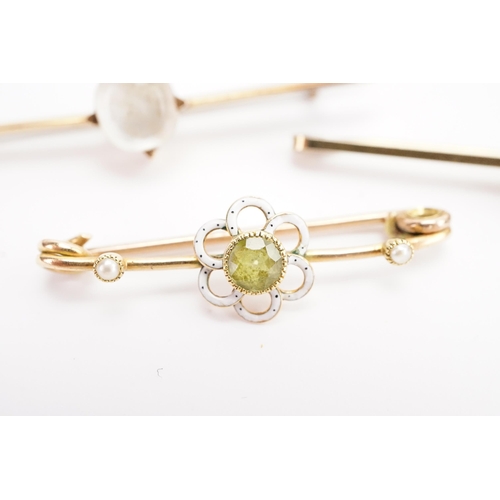 134 - A gold coloured peridot and seed pearl brooch, along with two other brooches. Total weight 7.6g.