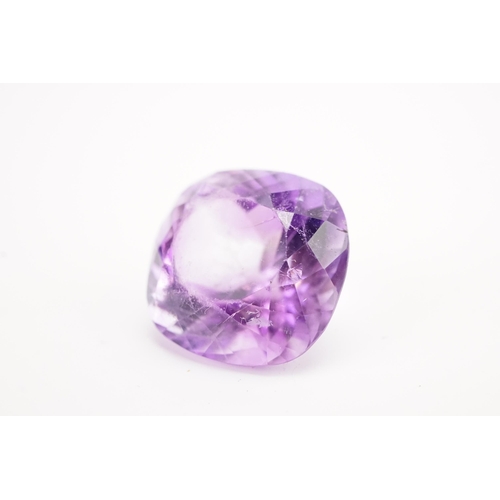 135 - A large 18mm x 18.6mm x 12.85mm cushion cut amethyst. Weight 5.5g.