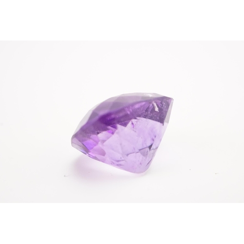 135 - A large 18mm x 18.6mm x 12.85mm cushion cut amethyst. Weight 5.5g.