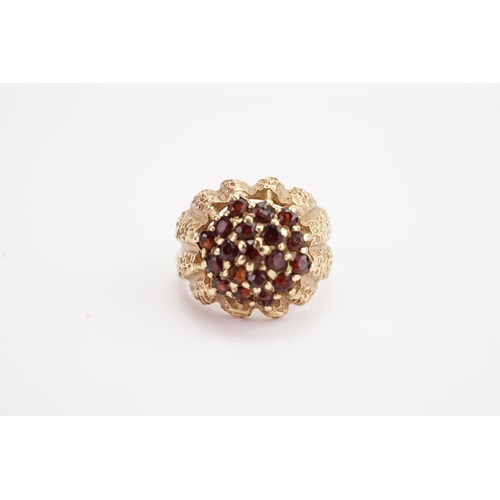 145 - A 9ct gold garnet set ring. Weight 7.5g. Size P.