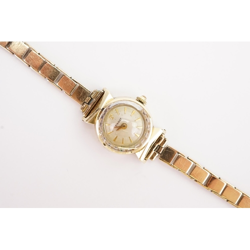 205 - A ladies 15ct gold cased Tissot watch, 9ct gold strap. Total weight 16g.