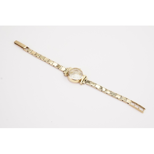 205 - A ladies 15ct gold cased Tissot watch, 9ct gold strap. Total weight 16g.