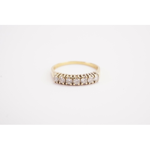 111 - A gold coloured diamond set ring. Set with 7 0.05ct diamonds. Weight 3g. Size T.