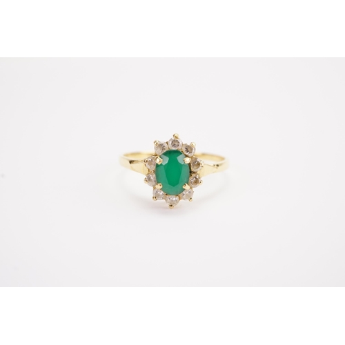 112 - A 18ct gold paste and green stone set ring. Weight 2.5g. Size S.