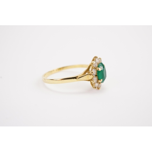 112 - A 18ct gold paste and green stone set ring. Weight 2.5g. Size S.