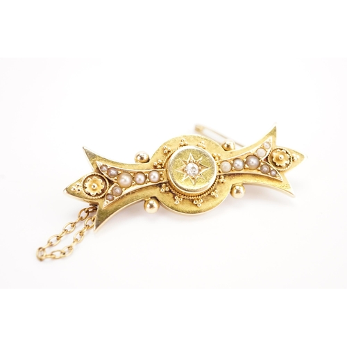 113 - A gold coloured diamond and seed pearl brooch. Weight 4.9g.