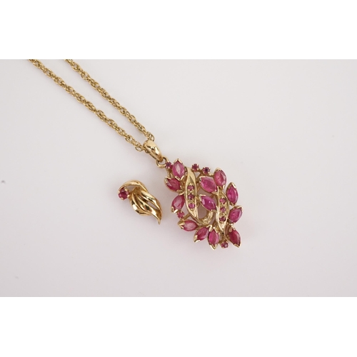 120 - A 9ct gold ruby set pendant, hung on a 9ct gold chain. Along with a single earring. Weight 5.9g.