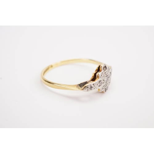 127 - A 18ct and platinum set diamond ring, in the art deco design. Largest diamond approximately 0.05ct. ... 