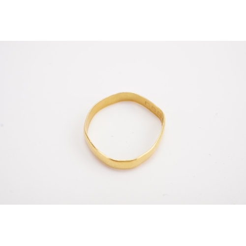 129 - A 22ct gold wedding band. Weight 1.8g.