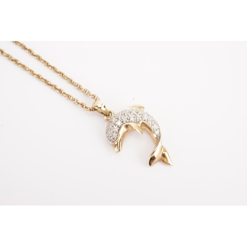 124 - A 9ct gold chain, hung with a 9ct gold diamond dolphin. Weight 4.9g.