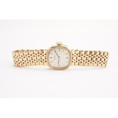 200 - A ladies 9ct gold Record watch, 9ct gold strap. Weight without mechanism 20g including glass.