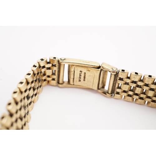 200 - A ladies 9ct gold Record watch, 9ct gold strap. Weight without mechanism 20g including glass.