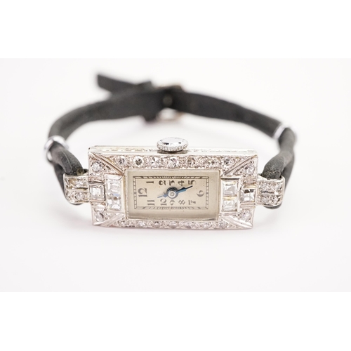 201 - A ladies platinum and diamond set cocktail watch. Set with 26 brilliant cut diamonds and 6 princess ... 