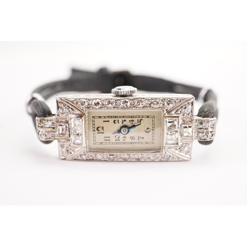 201 - A ladies platinum and diamond set cocktail watch. Set with 26 brilliant cut diamonds and 6 princess ... 