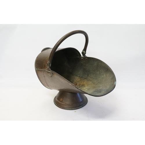 872 - A Copper Helmet Shaped Coal Bucket with Swing Handle.