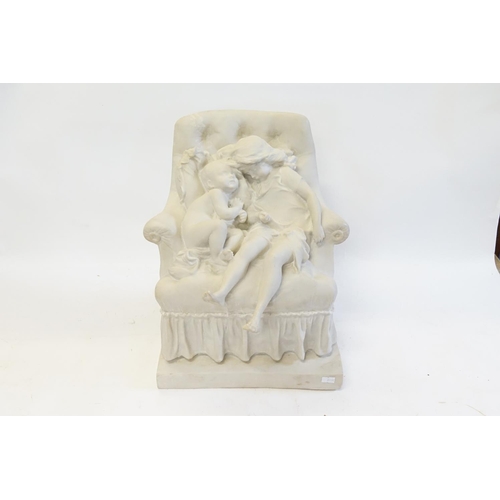 869 - A Reconstituted Marble effect Study of Victorian Children on a Over Stuffed Settee. Measuring: 40cms... 