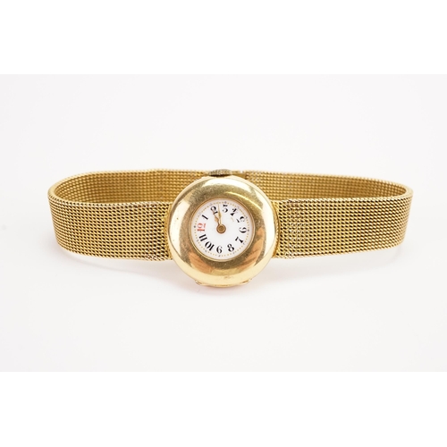 198 - A ladies 18ct gold wrist watch, circa 1890's. The watch has a enamelled rail road dial and a 15ct go... 