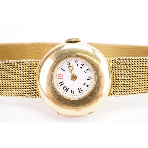 198 - A ladies 18ct gold wrist watch, circa 1890's. The watch has a enamelled rail road dial and a 15ct go... 