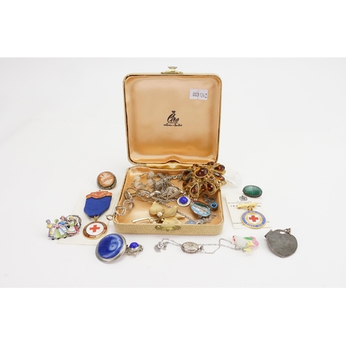 172 - A collection of costume jewellery, to include a silver cross, brooches, bracelets etc.