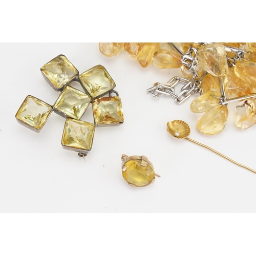 168 - A unmarked citrine earring, along with a similar brooch, bead necklace, a foreign gold stick pin 1g.