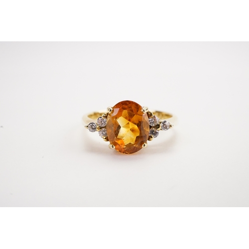 157 - A 14k gold Citrine & Zirconium mounted ring. Wieght: Size: