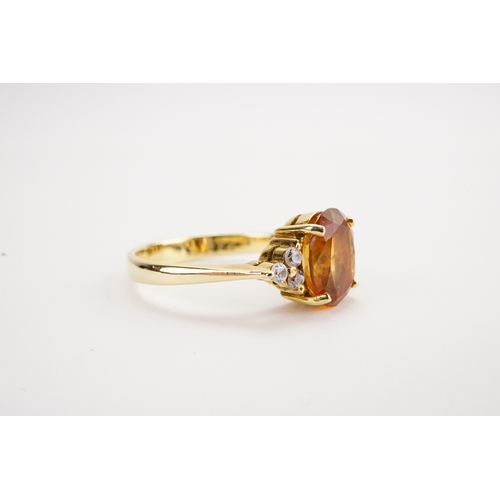 157 - A 14k gold Citrine & Zirconium mounted ring. Wieght: Size: