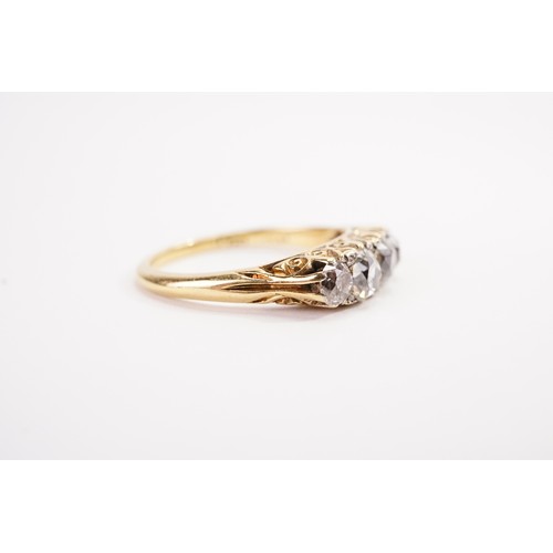 137 - A 18ct gold diamond set ring, set with five old mine cut diamonds, the largest approximately 0.5ct. ... 