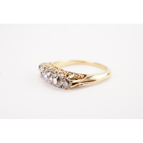 137 - A 18ct gold diamond set ring, set with five old mine cut diamonds, the largest approximately 0.5ct. ... 