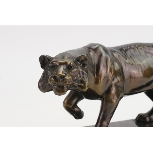 574 - A Bronze Study of a Tiger on a Marble Base.