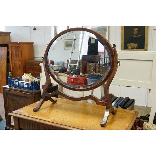 543 - A Swing Framed Toilet Mirror with inlay on a shaped stand with bevelled Glass.