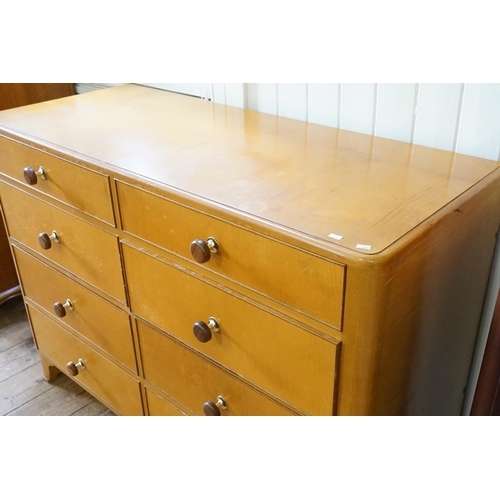 469 - A Late 1930s Blond Maple Haberdashers Chest of Eight Drawers. Measuring: 130cms across x 54cms deep ... 