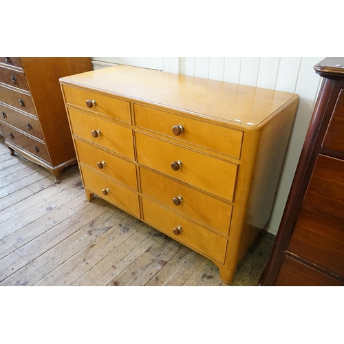 469 - A Late 1930s Blond Maple Haberdashers Chest of Eight Drawers. Measuring: 130cms across x 54cms deep ... 