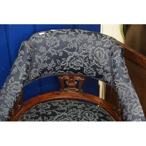 470 - A Pair of Victorian Bow Backed Drawing Room Chairs resting on turned legs.