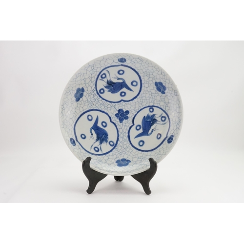 667 - Ex Collection of Rev. John Gage Waller. A Japanese Arita Circular Dish decorated with Storks on a bl... 