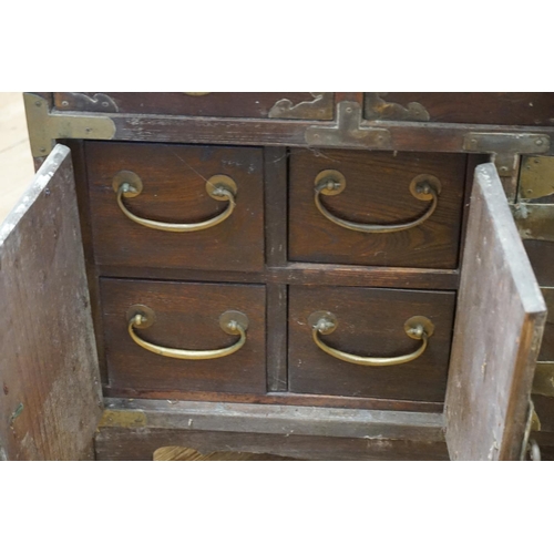 471 - Ex Collection of Rev. John Gage Waller. A Japanese Hardwood Metal Mounted Multi Drawers & Door Cabin... 