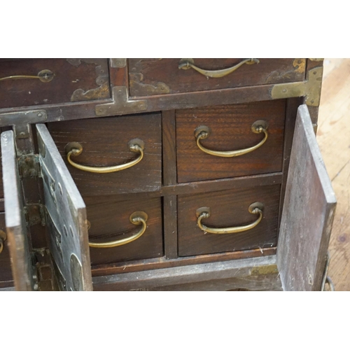 471 - Ex Collection of Rev. John Gage Waller. A Japanese Hardwood Metal Mounted Multi Drawers & Door Cabin... 